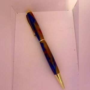 Hand-made pens Great quality Blue, red, and a goldish-yellow color Twist to open